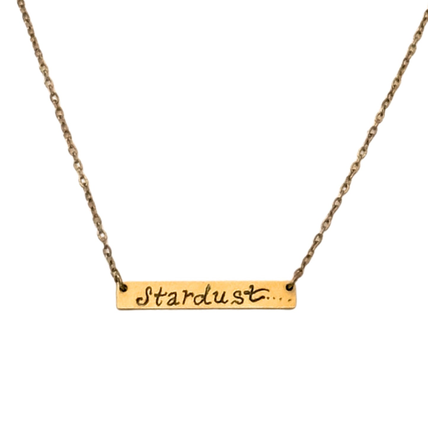 Gold necklace with 'Stardust' pendant on a white background