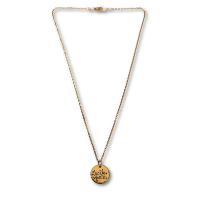 Gold necklace with engraved gold pendant in script featuring a name